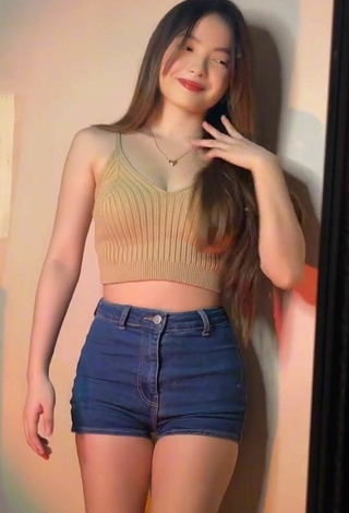 4. Hot Madelaine Red Shows Cleavage in Beige Crop Top