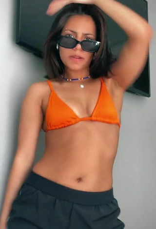 5. Sexy Manu Heinze Shows Cleavage in Orange Bikini Top
