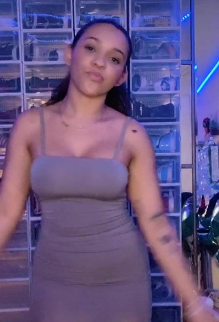 1. Hottie River Bleu Shows Cleavage in Grey Dress