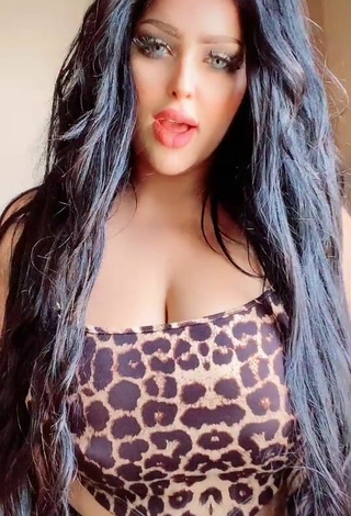 Sexy Salma Elshimy Shows Cleavage in Leopard Crop Top