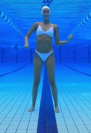 1. Cute Silvia Solymosyová Shows Cleavage in White Bikini at the Pool