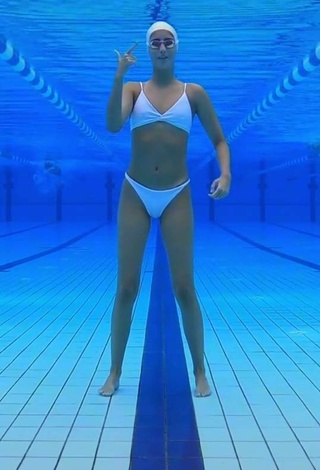 2. Cute Silvia Solymosyová Shows Cleavage in White Bikini at the Pool
