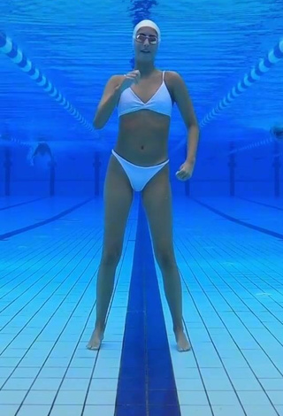 3. Cute Silvia Solymosyová Shows Cleavage in White Bikini at the Pool