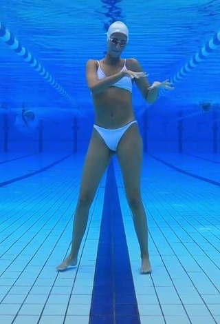 5. Cute Silvia Solymosyová Shows Cleavage in White Bikini at the Pool