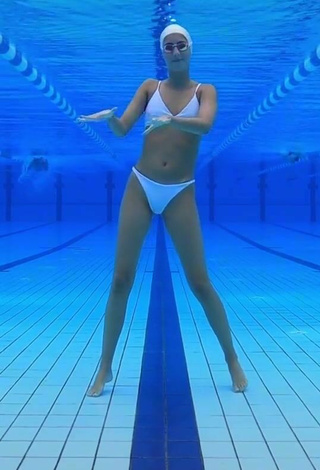 6. Cute Silvia Solymosyová Shows Cleavage in White Bikini at the Pool