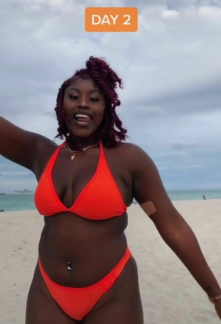 Dazzling Skaibeauty Shows Cleavage in Inviting Electric Orange Bikini and Bouncing Boobs at the Beach