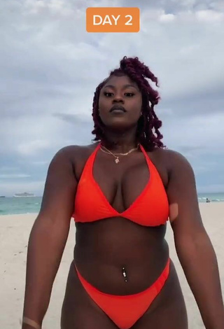 6. Dazzling Skaibeauty Shows Cleavage in Inviting Electric Orange Bikini and Bouncing Boobs at the Beach