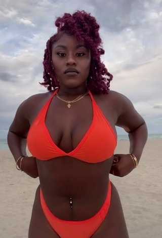 Elegant Skaibeauty Shows Cleavage in Electric Orange Bikini at the Beach