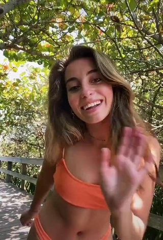 2. Sexy Léa Martinez Shows Cleavage in Orange Bikini