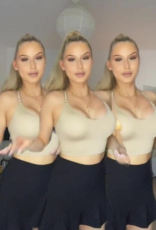 Antonia Rot shows appealing Beige Crop Top and Cleavage