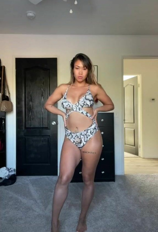 5. Cute Atqofficial Shows Cleavage in Snake Print Swimsuit