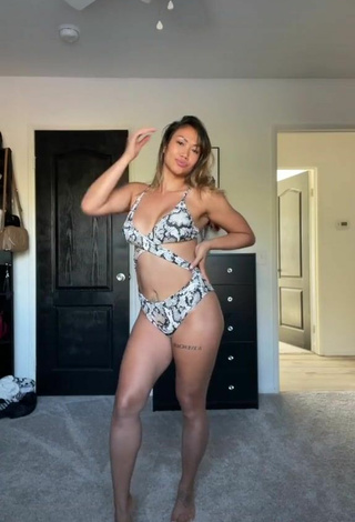 6. Cute Atqofficial Shows Cleavage in Snake Print Swimsuit