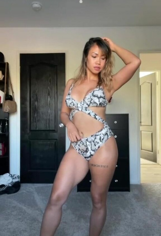 3. Hot Atqofficial Shows Cleavage in Snake Print Swimsuit