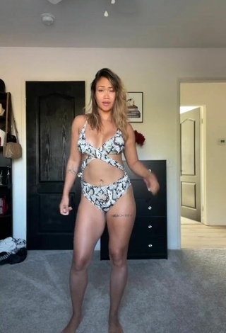 3. Sexy Atqofficial Shows Cleavage in Snake Print Swimsuit