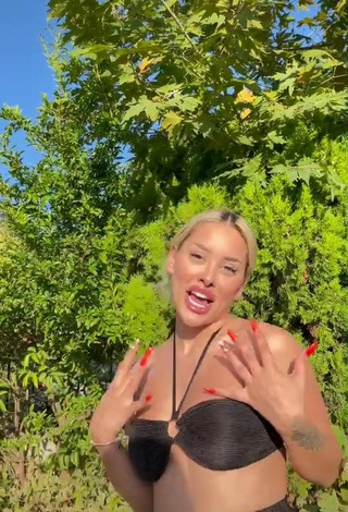 Sexy Cansu Tekin Shows Cleavage in Black Bikini Top