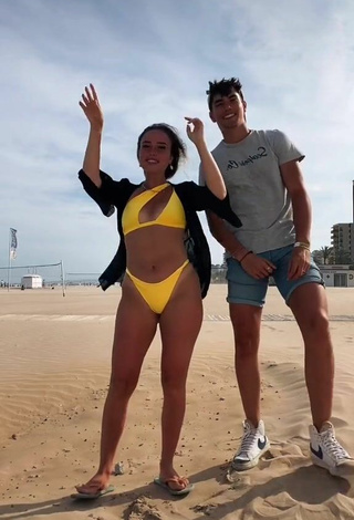 Sexy Celia Pergo Shows Cleavage in Yellow Bikini at the Beach