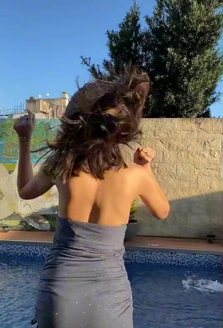 4. Sexy Dai Amadeo Shows Cleavage in Grey Dress at the Pool