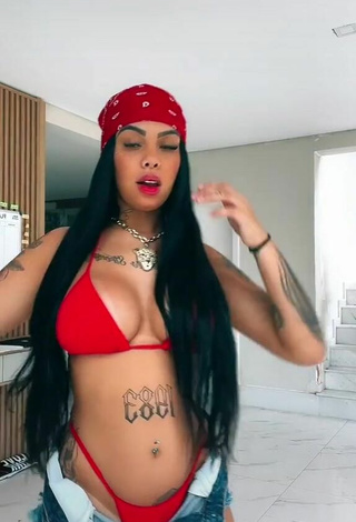 Pretty Nathi Rodrigues Shows Cleavage in Red Bikini