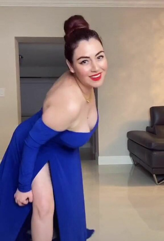 Seductive Jane Rocci Shows Cleavage in Blue Dress