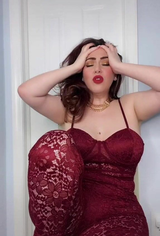 5. Hot Jane Rocci Shows Cleavage in Red Bodysuit