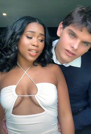 Beautiful Lluvia Faye Shows Cleavage in Sexy White Dress