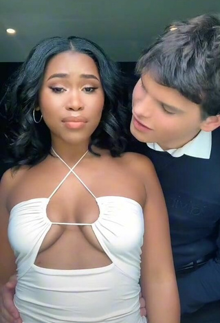 4. Beautiful Lluvia Faye Shows Cleavage in Sexy White Dress