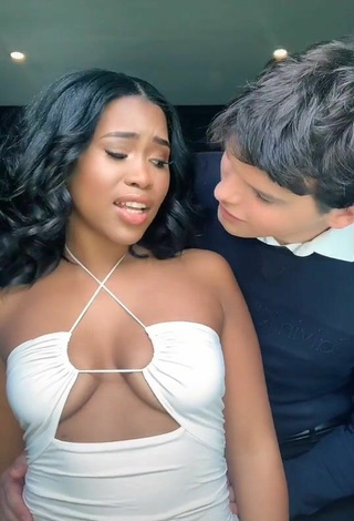 6. Beautiful Lluvia Faye Shows Cleavage in Sexy White Dress