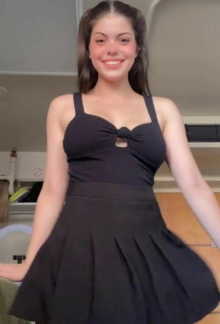 1. Sexy Madelyn Shows Cleavage in Black Dress
