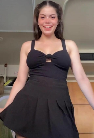2. Sexy Madelyn Shows Cleavage in Black Dress