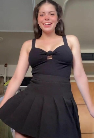 3. Sexy Madelyn Shows Cleavage in Black Dress