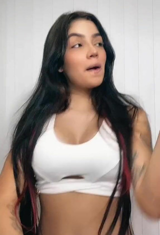 3. Hottie Henny Shows Cleavage in White Crop Top