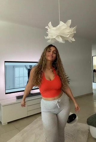 6. Sexy Jeje Lopes Shows Cleavage in Orange Crop Top