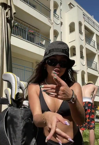 Cute Mai Lee Shows Cleavage in Black Bikini Top