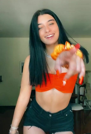 2. Sexy Sofia Crisafulli Shows Cleavage in Orange Tube Top