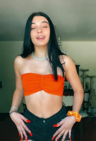 3. Sexy Sofia Crisafulli Shows Cleavage in Orange Tube Top