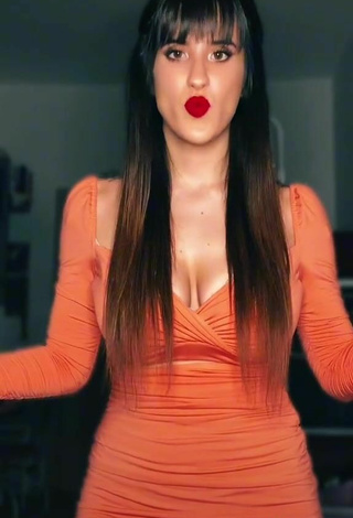 6. Hot Alice Iori Shows Cleavage in Orange Dress