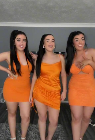 2. Sexy Terrytriplets Shows Cleavage in Orange Dress and Bouncing Boobs