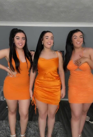 3. Sexy Terrytriplets Shows Cleavage in Orange Dress and Bouncing Boobs