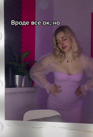 Sexy Veronika Dmitriieva Shows Cleavage in Purple Dress