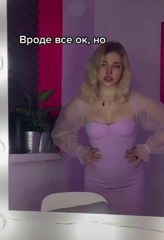 3. Sexy Veronika Dmitriieva Shows Cleavage in Purple Dress