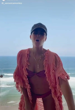 Cute Verónica Montes Shows Cleavage in Purple Bikini