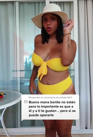 2. Cute Adelaida Tassoni Shows Cleavage in Yellow Bikini