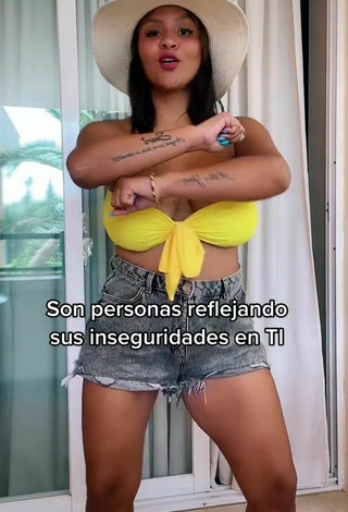 5. Beautiful Adelaida Tassoni Shows Cleavage in Sexy Yellow Bikini Top and Bouncing Tits