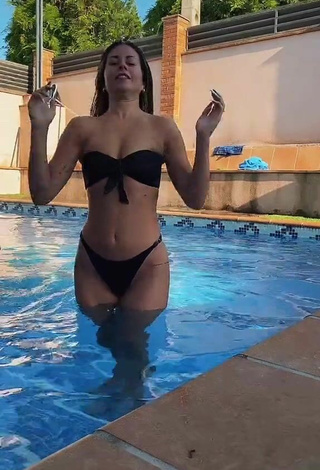 1. Sweet Alba López Shows Cleavage in Cute Black Bikini at the Swimming Pool