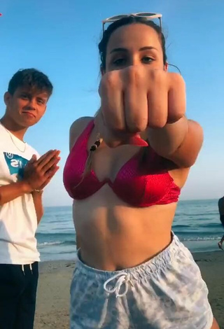2. Hottest Beatrice Cossu Shows Cleavage in Red Bikini Top at the Beach