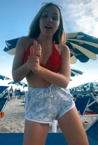 Erotic Beatrice Cossu Shows Cleavage in Bikini Top at the Beach