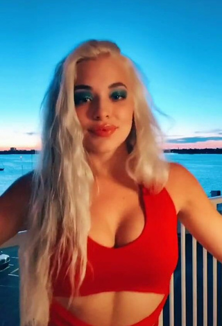 5. Wonderful Bella Martinez Shows Cleavage in Red Crop Top on the Balcony
