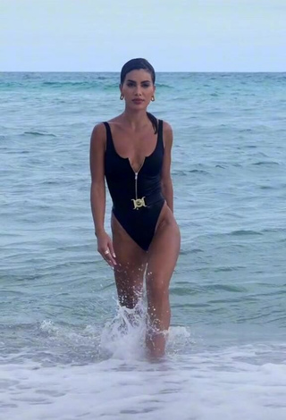 Sexy Camila Coelho Shows Cleavage in Black Swimsuit in the Sea