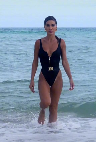 2. Sexy Camila Coelho Shows Cleavage in Black Swimsuit in the Sea