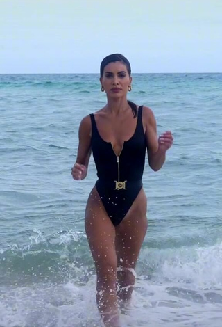 3. Sexy Camila Coelho Shows Cleavage in Black Swimsuit in the Sea